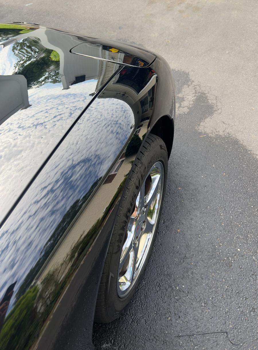 Black car exterior detail chrome wheels Long Island NY